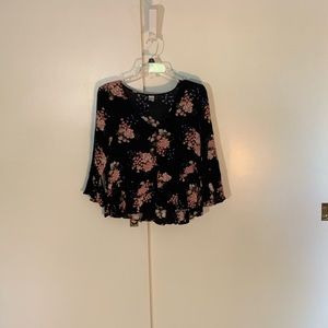 Flowy, mid length sleeve, floral shirt.